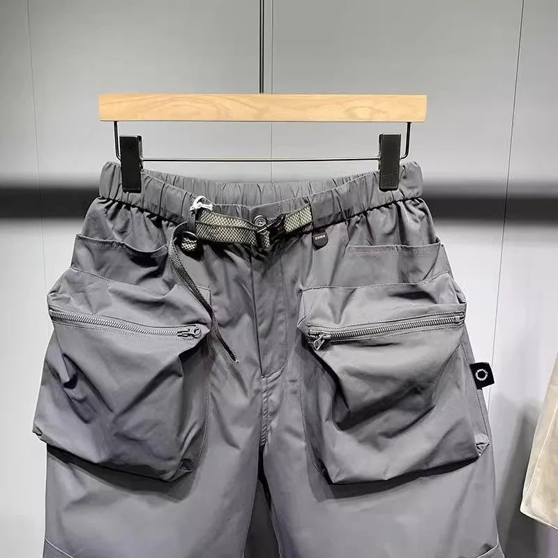 Men's loose fit work shorts in black or grey with pockets and non-iron treatment