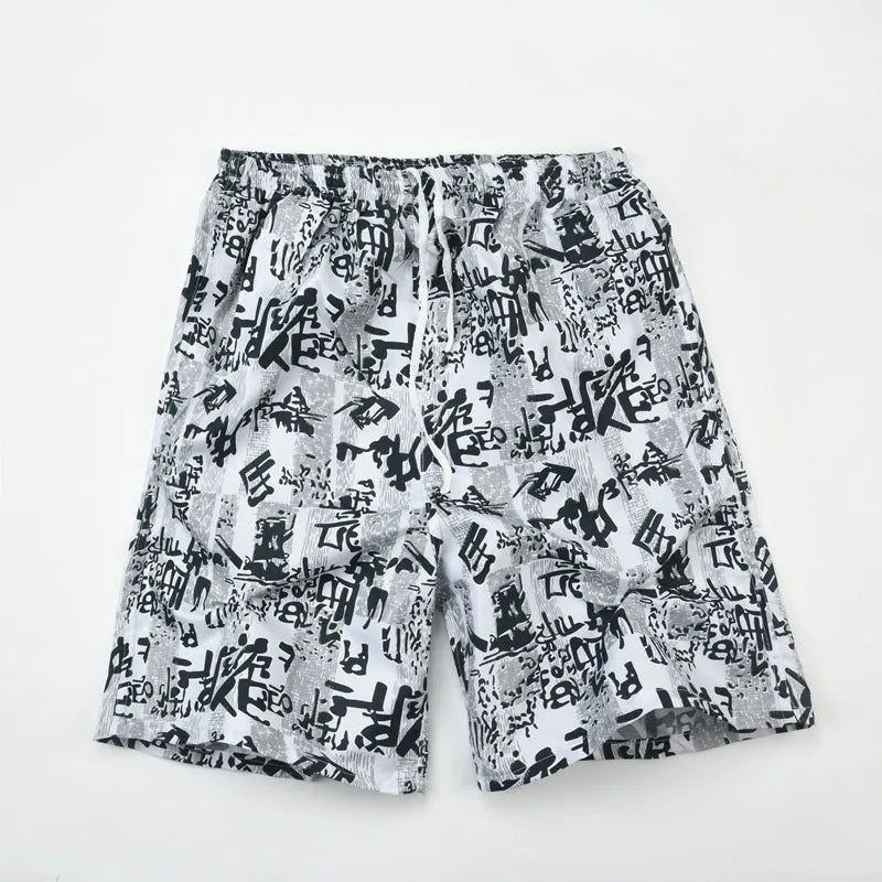 Men's printed five-point swimming trunks with floral pattern in polyester fabric