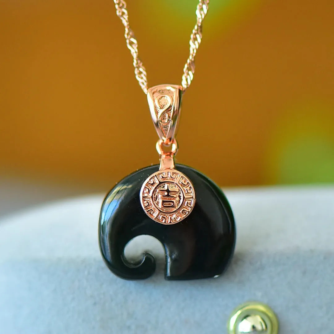 Flat geometric Hetian jade pendant with copper inlay on a necklace chain.
