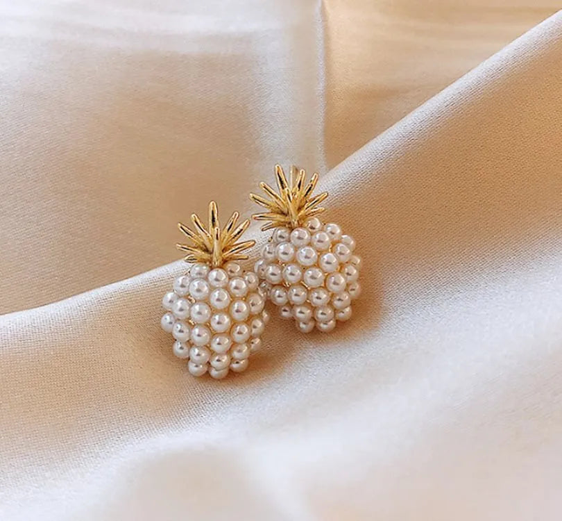 Korean-style women's drop earrings with a pineapple starfish pearl design in alloy with stone inlay.