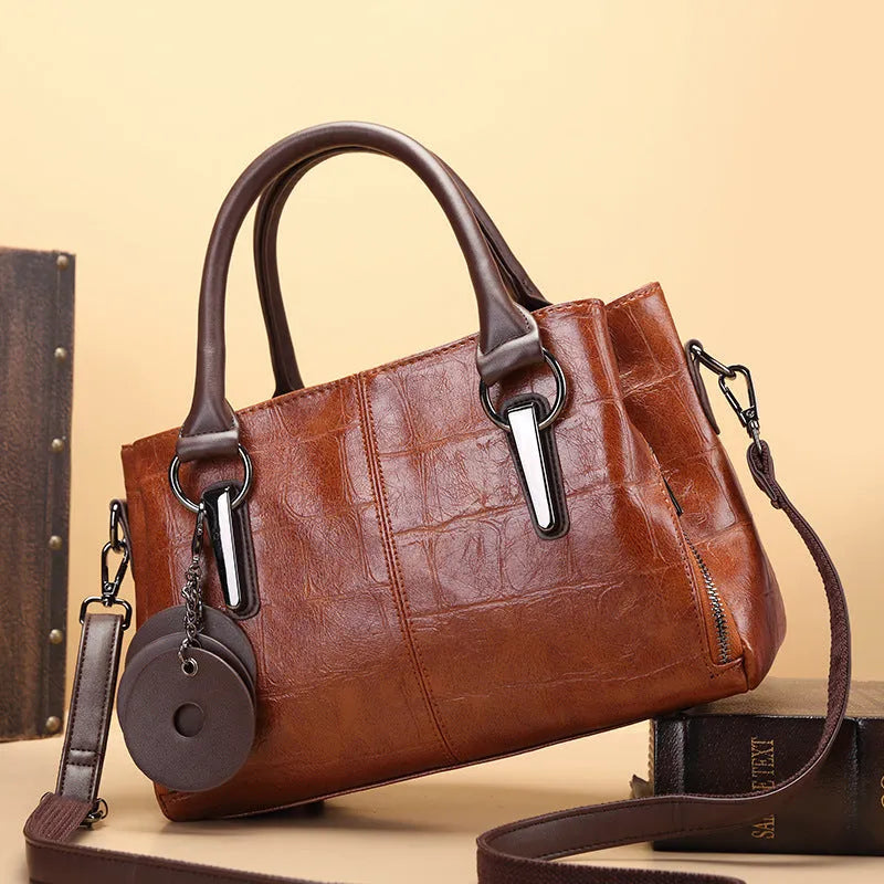 Horizontal square PU leather shoulder bag with single strap showing internal organiser compartments