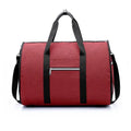 Medium sized cylindrical duffle travel bag in black, shown with zipper open, made from Oxford cloth.