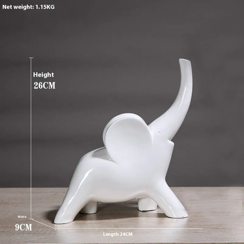 Modern resin elephant ornament in rose gold colour displayed on wooden surface