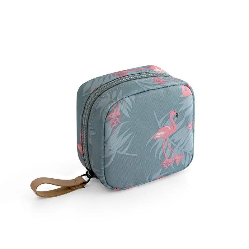 A cube-shaped cloth makeup storage bag available in blue, pink, white, and white pink colours.