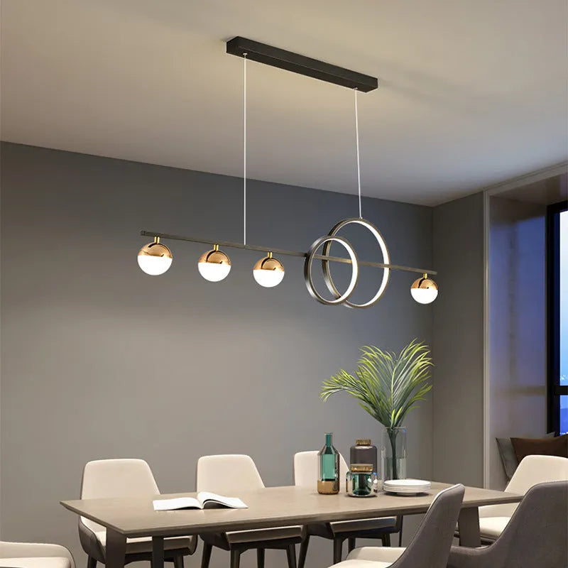Modern rectangular aluminium ceiling light in black finish with remote control on a white ceiling.