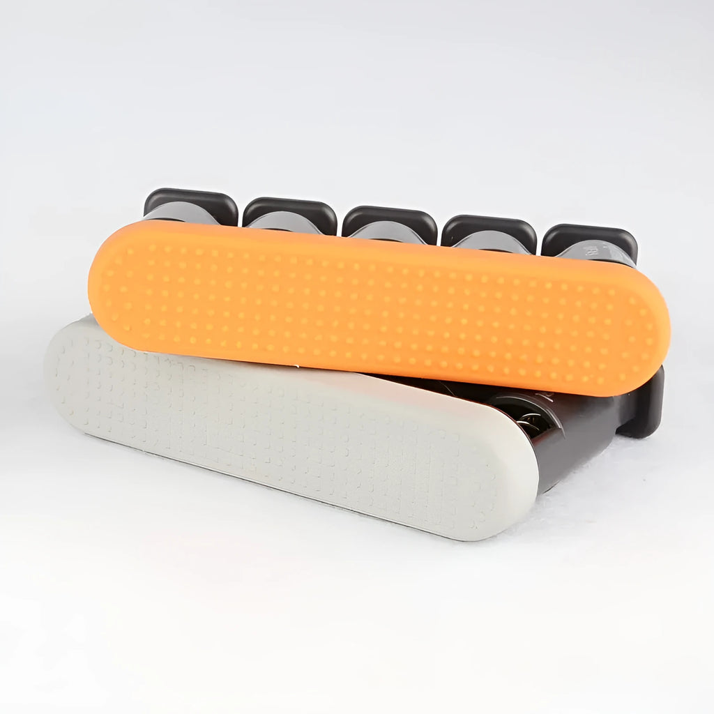 Grey and orange silicone finger trainer for musician hand strength development