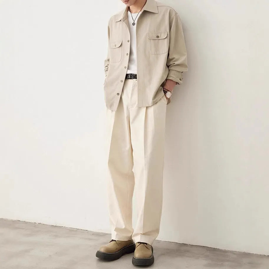 Men's light sand rice casual lapel collar long sleeve shirt on a hanger.