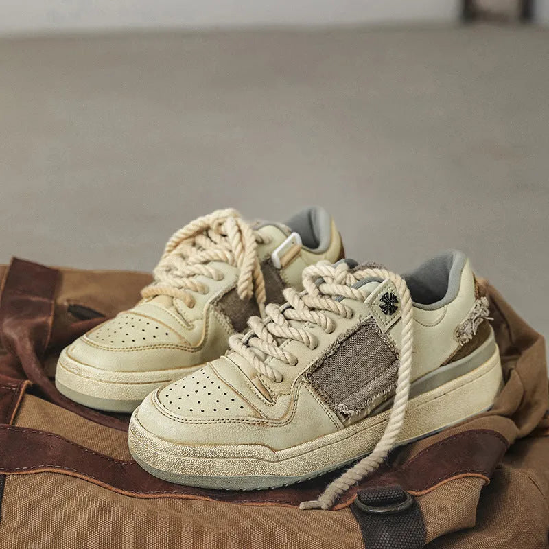 Beige microfiber skateboard shoes with flat rubber sole and lace-up closure