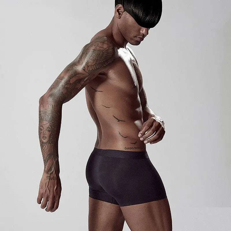 Men's seamless modal underwear in green, pink, and white with mid waist design