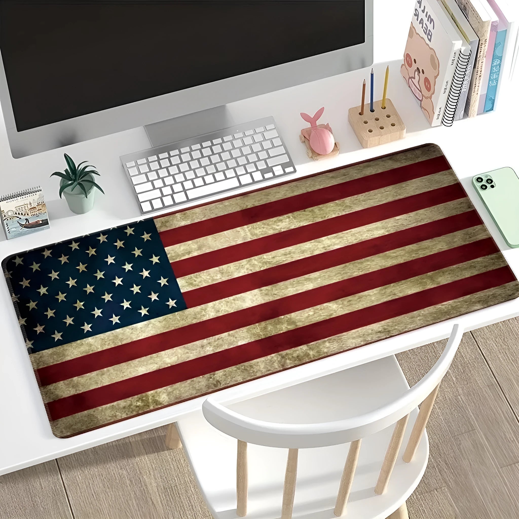 Large thermal transfer printed mouse pad with natural rubber non-slip base on a desk.