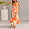 Long striped backless dress with square neck, side pockets, and adjustable suspender straps.