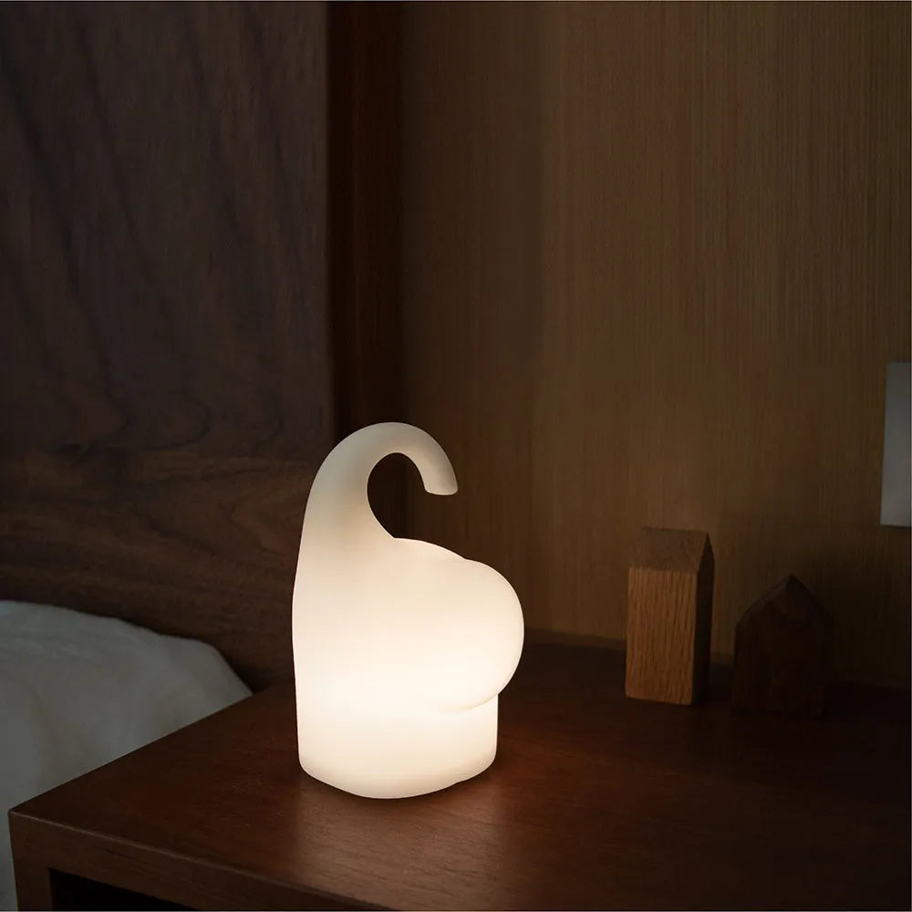 DOMI elephant-shaped silicone night light with dimmer control on bedside table
