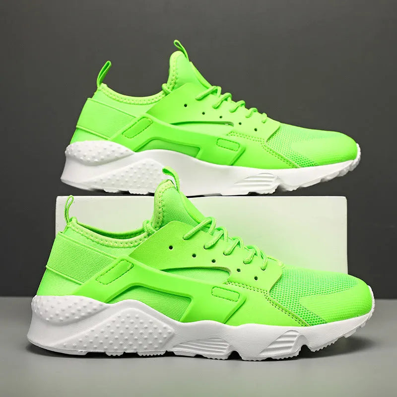Men's low top casual shoes in fluorescent red with mesh upper, cross shoulder straps, and flat MD sole.