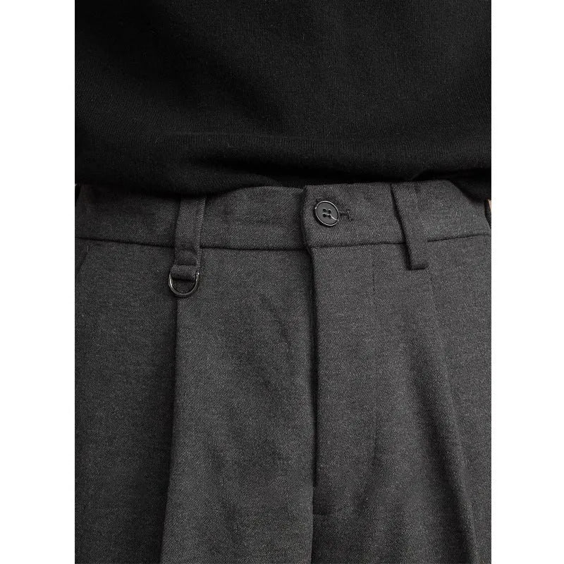 Men's straight leg polyester trousers in black on a hanger, business casual style