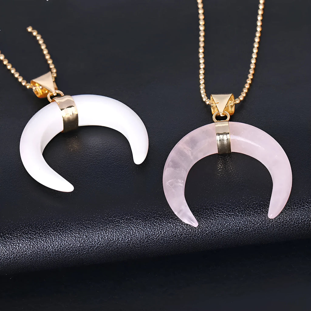 Close-up of a natural stone moon pendant necklace on an electroplated copper chain.