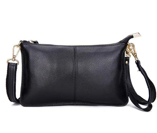 Structured cowhide leather lady slant bag showing front zipper compartment and dual strap options