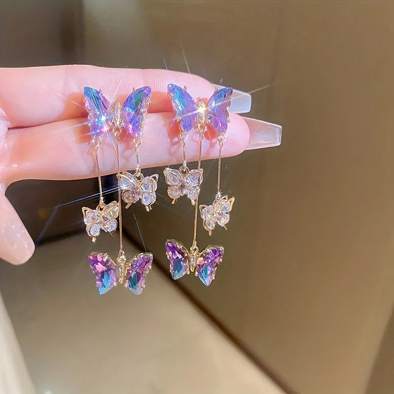 Silver needle colour crystal butterfly earrings with blue-purple electroplated finish and tassel elements
