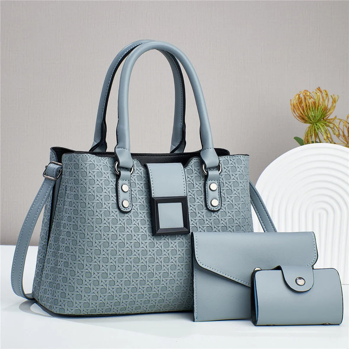 Textured weave design women's crossbody bag in apricot colour, showing internal organiser compartments.