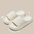 Leaf texture design EVA indoor slippers in multiple colours on a white background.