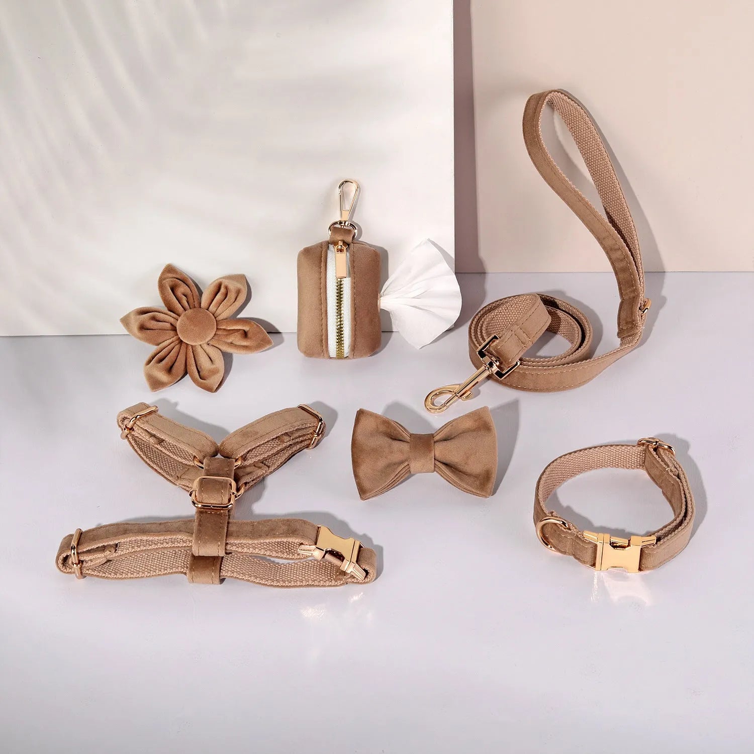 Soft cloth pet harness and lead set in velvet, showing collar, chest strap, lead, bow tie, and flower accessory.