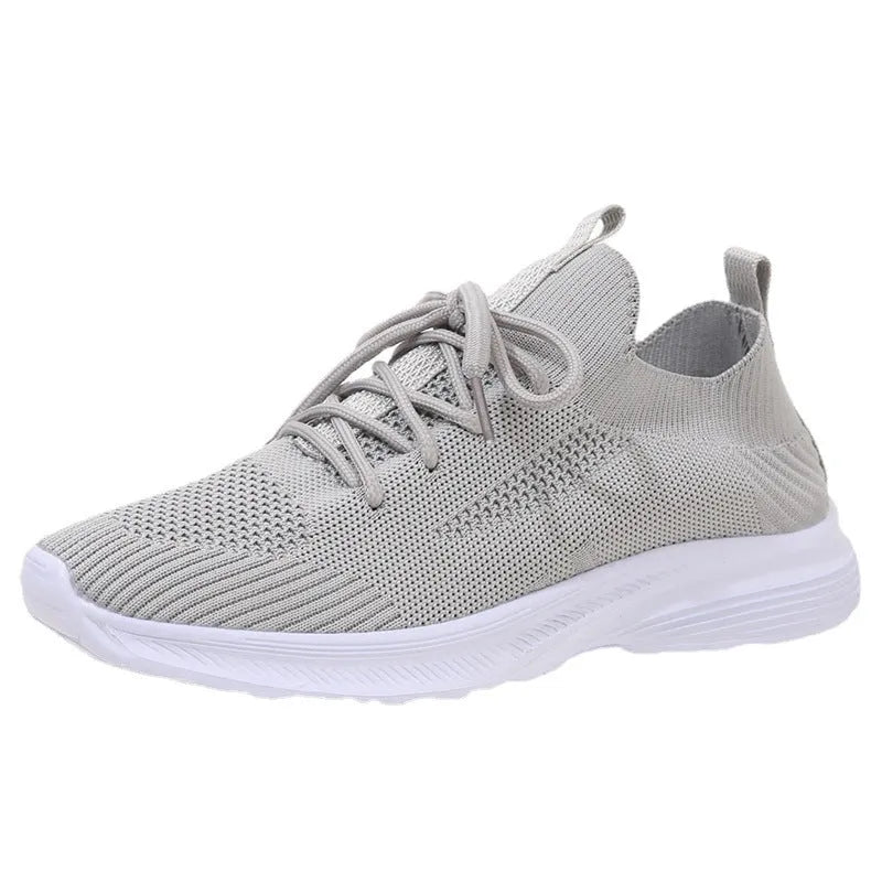Women's mesh running shoes in Creamy White colour with Flyknit upper and rubber sole