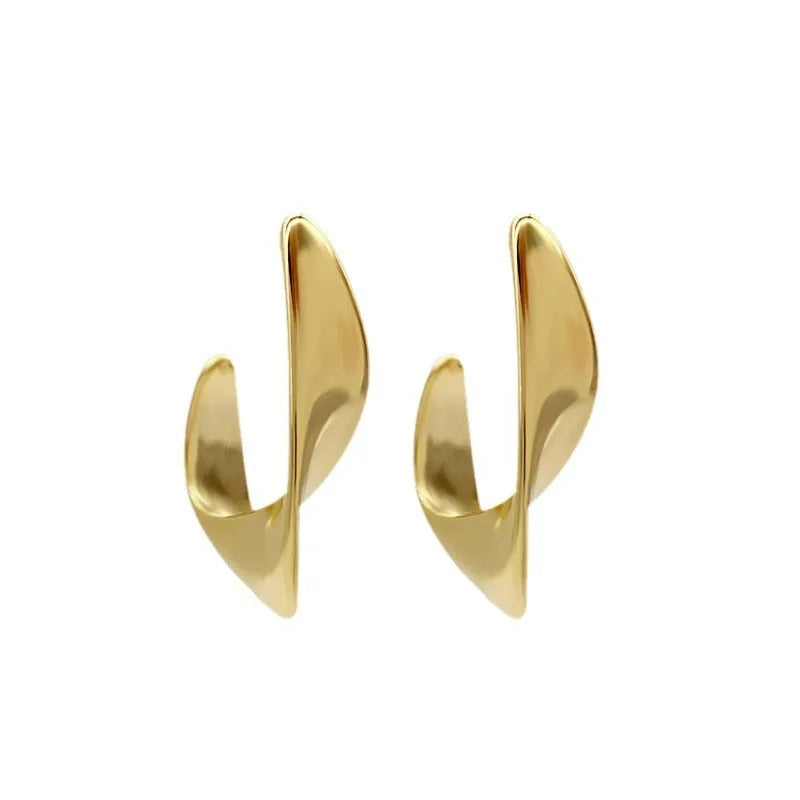 Metal geometric twisted earrings with round elements in gold or silver electroplated finish