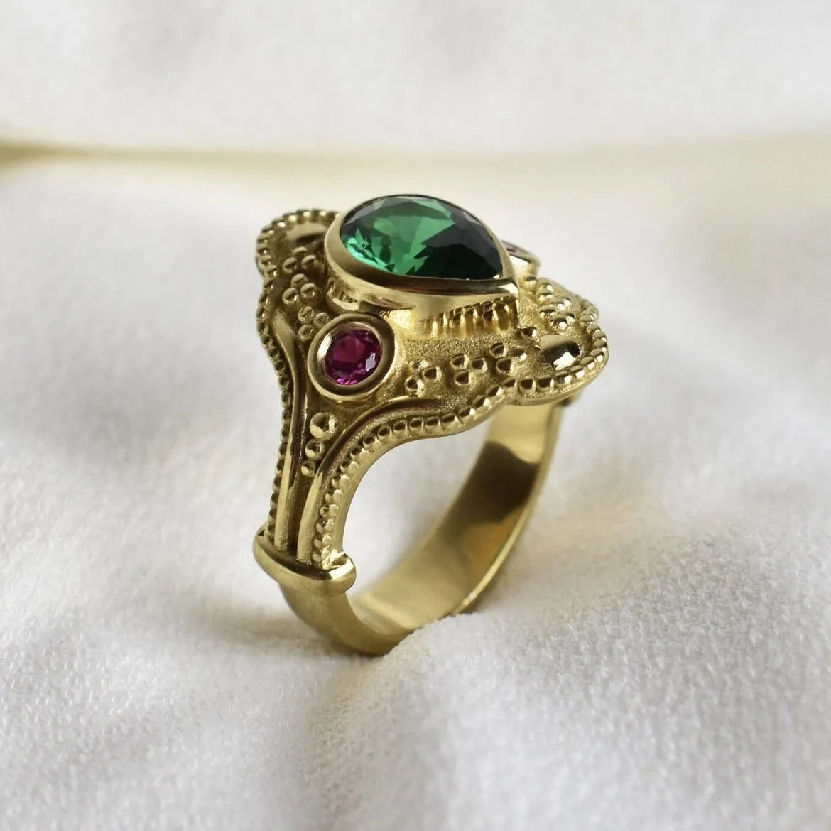 Women's gold-plated geometric ring with electroplated golden lvzuan finish showing side view