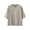 Men's sand grey loose fit short sleeve cotton polyester t-shirt on a hanger.