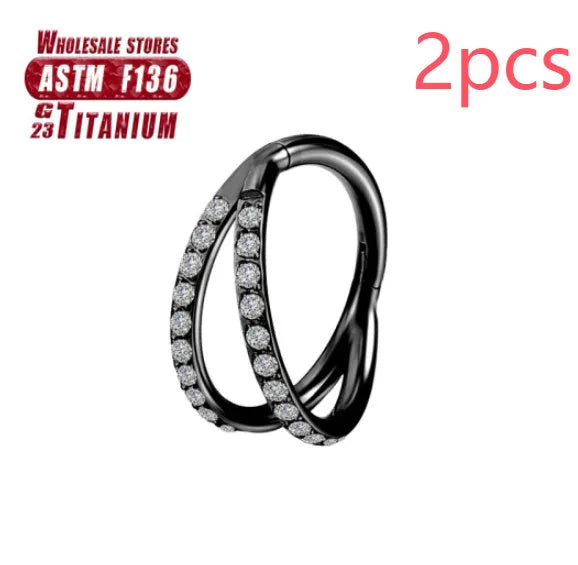 Titanium alloy nose ring on a plain background, shown in silver and gold finishes.