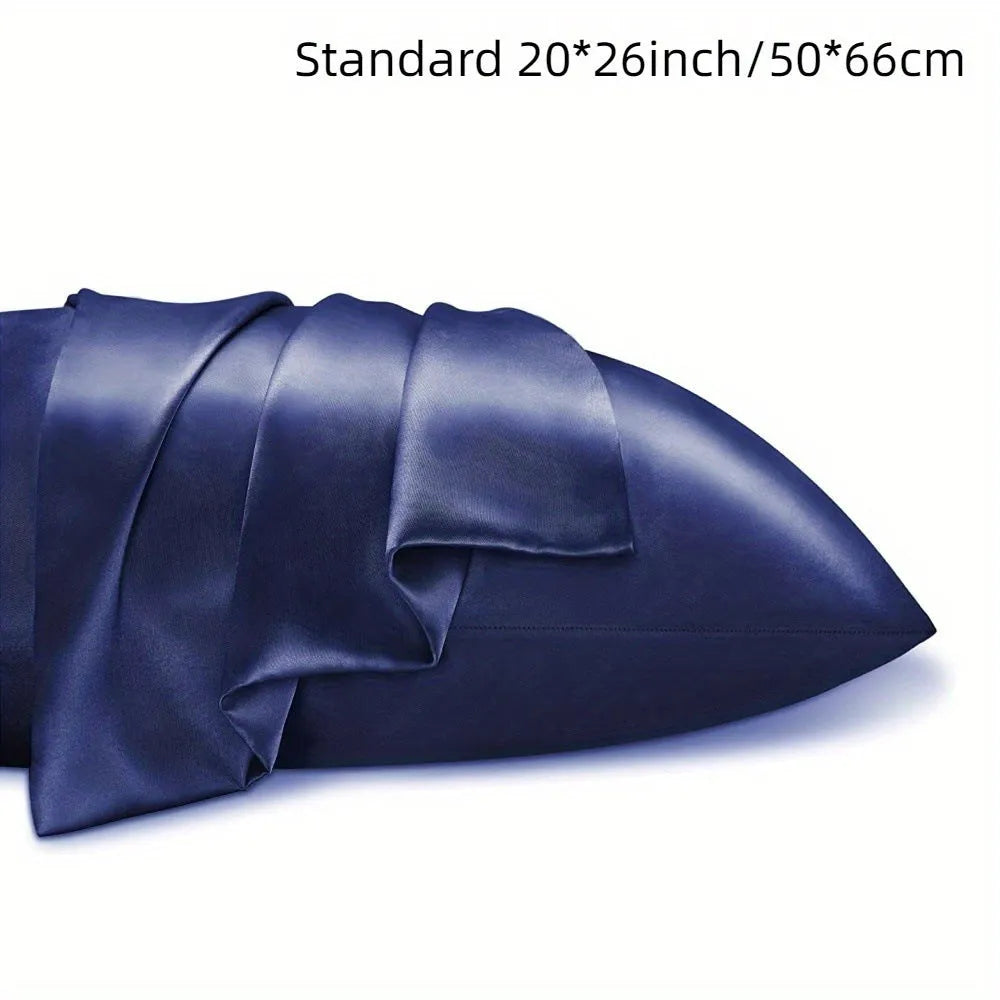 A pair of solid colour satin pillowcases in a chosen shade, showing the smooth plain weave fabric texture.