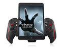 PG-9023 wireless telescopic game controller with phone attached showing adjustable clip and gamepad layout