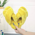 Cross open-toe fur slippers in black on a patterned non-slip sole