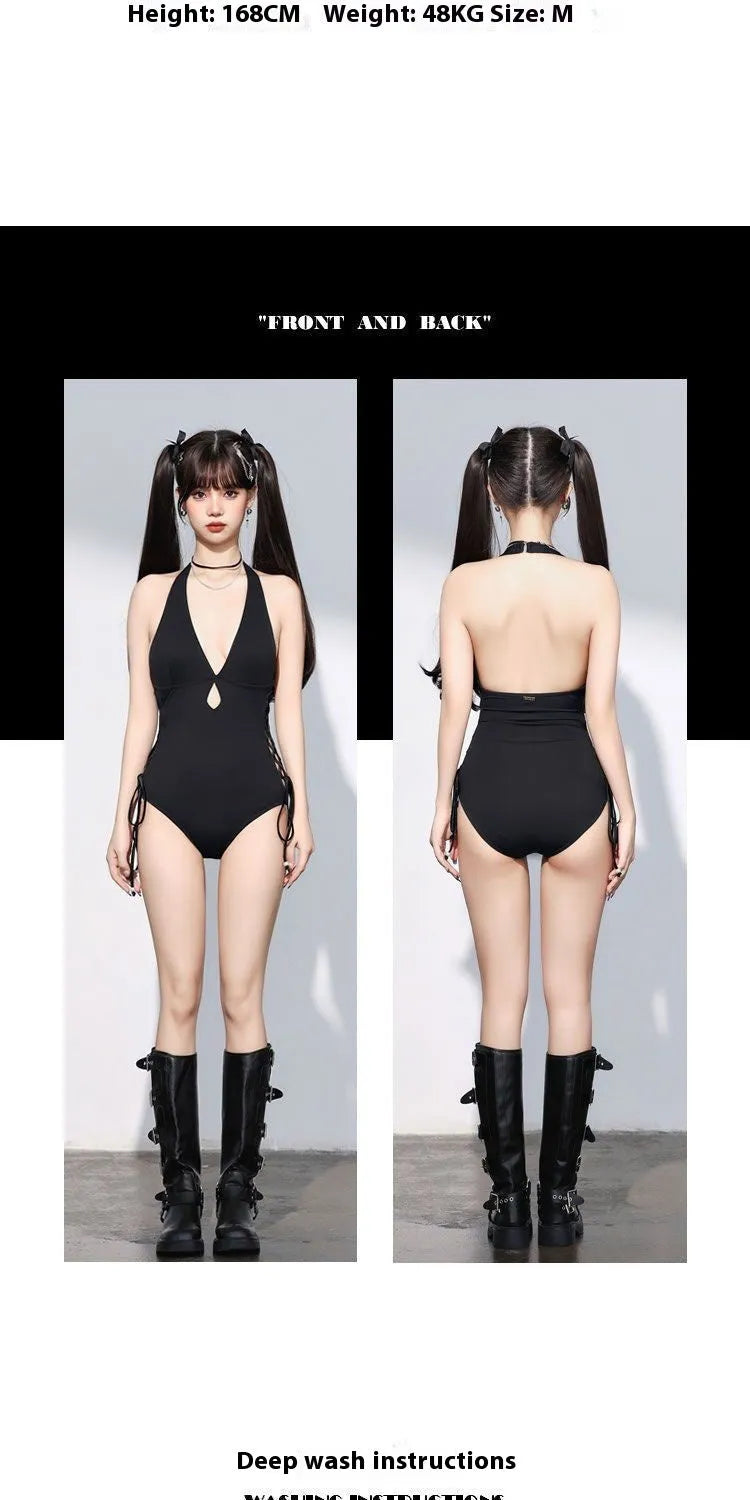 Women's V-neck hollow strap one-piece swimsuit in black, front view, shown on a model