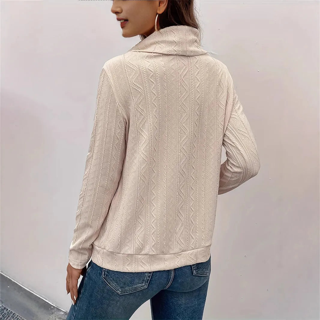 Apricot coloured long sleeve hooded pullover sweater on a hanger.