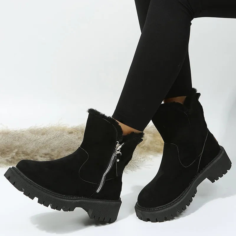 Women's black high-top snow boots with side zipper and thick plush lining on a winter background.