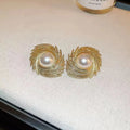 Gold plated pearl earrings with irregular flower shape design on alloy stud backs
