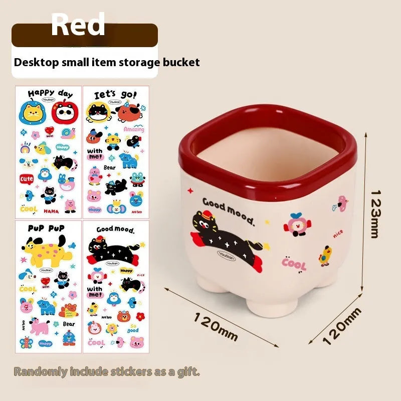 Red and brown cartoon-style plastic desktop storage organiser with grid pattern for stationery and sundries.