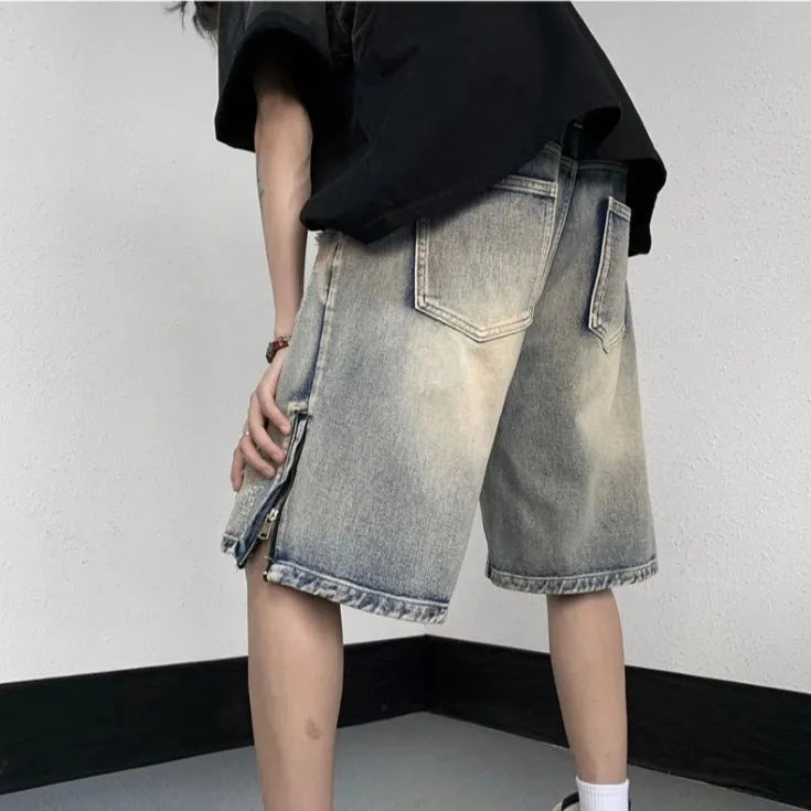 Blue retro tattered denim shorts with a wide leg loose fit on a mannequin