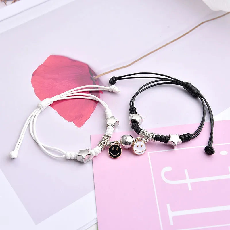 Magnetic couple bracelet pair with alloy electroplating in various designs including clover and crown patterns