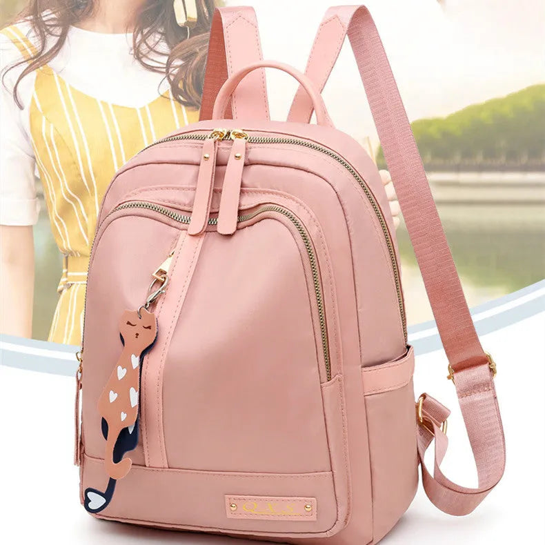Soft nylon casual backpack in black or pink with three-dimensional pockets and double shoulder straps