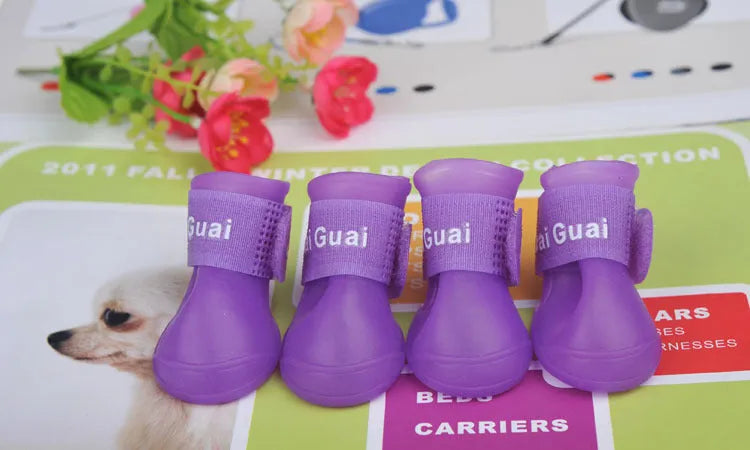 Soft silicone pet rain boots in royal blue and yellow, showing non-slip sole, for dogs size S M L