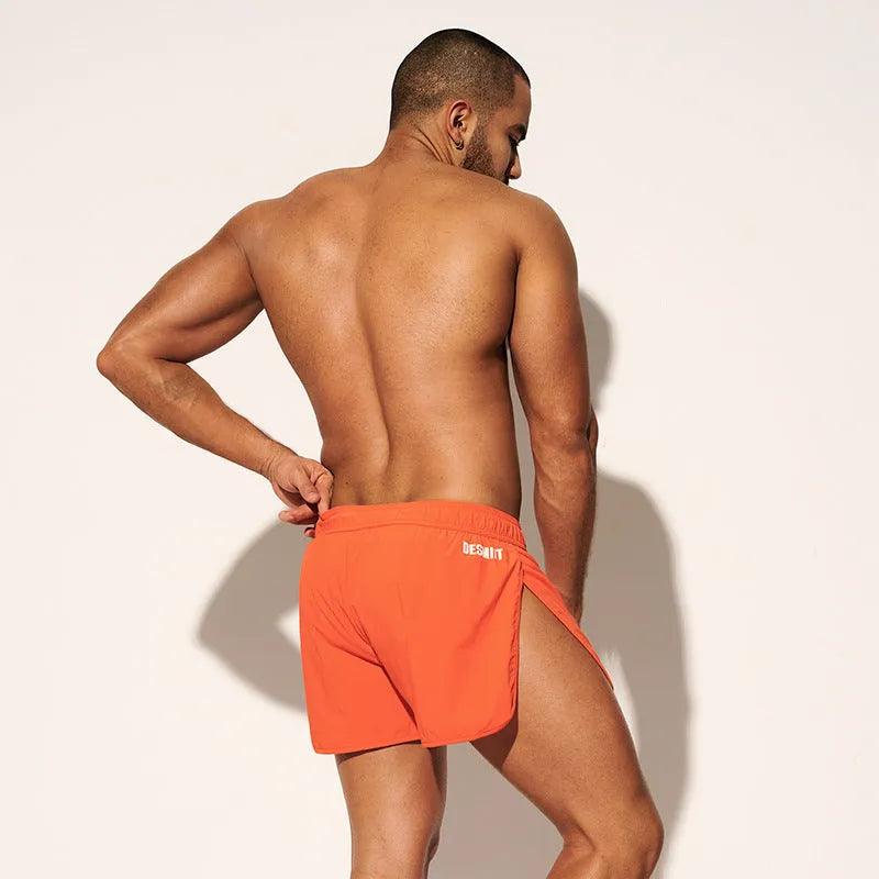 Men's loose fitting beach surfing trousers in polyester available in fluorescent green, orange red and black colours