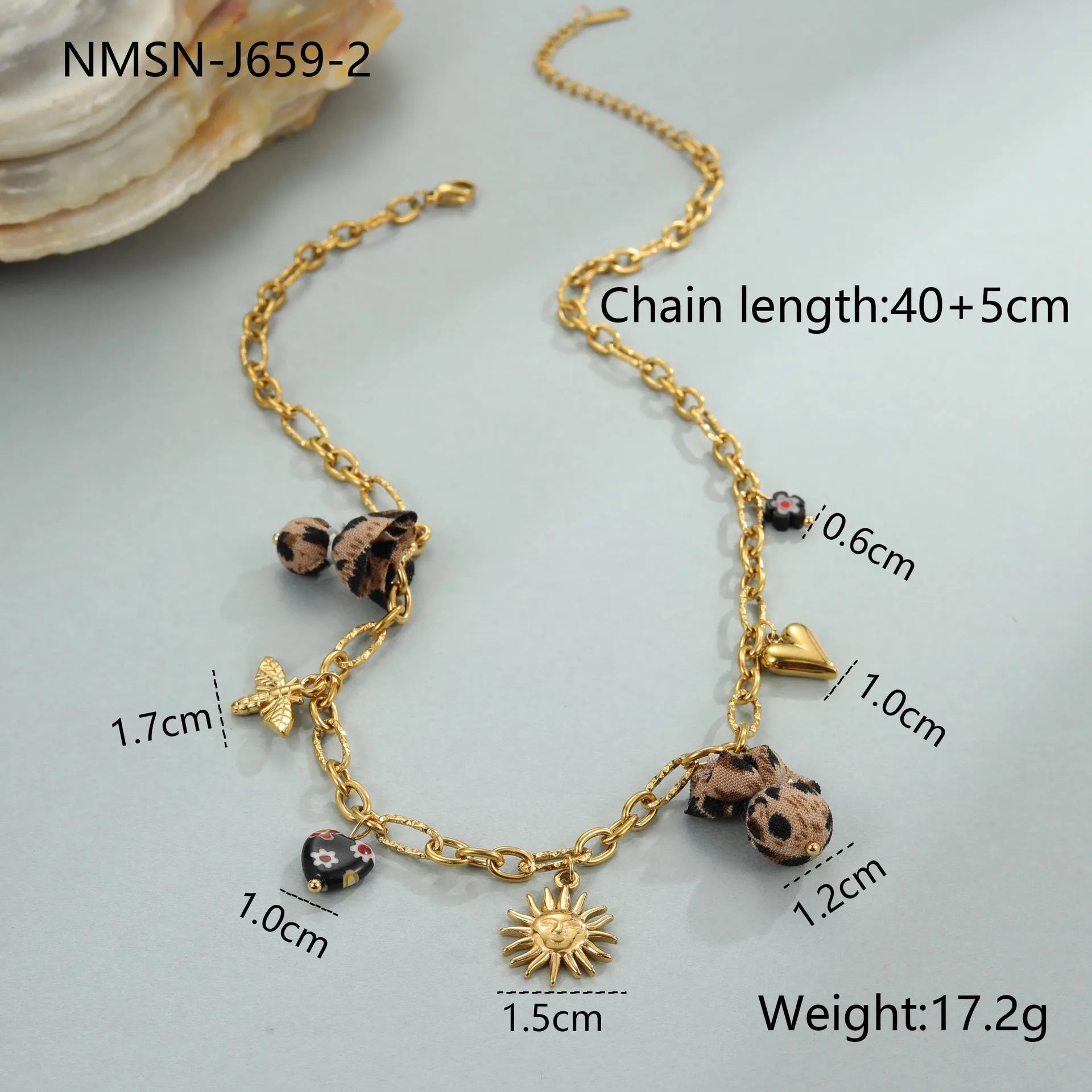 Gold-plated leopard pendant necklace with love heart and flower detailing on adjustable chain
