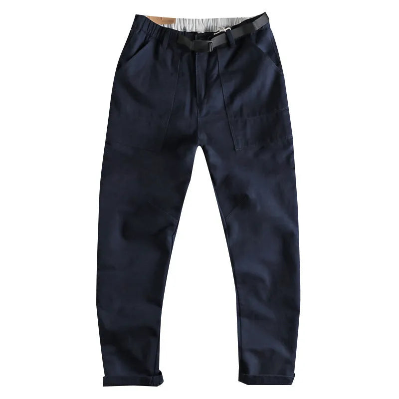 Cotton work trousers in khaki colour with mid waist design and zip fly closure