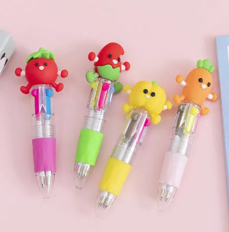 A cartoon-themed press-type ballpoint pen showing four-colour cartridge and a random print design on a silicone and plastic barrel.