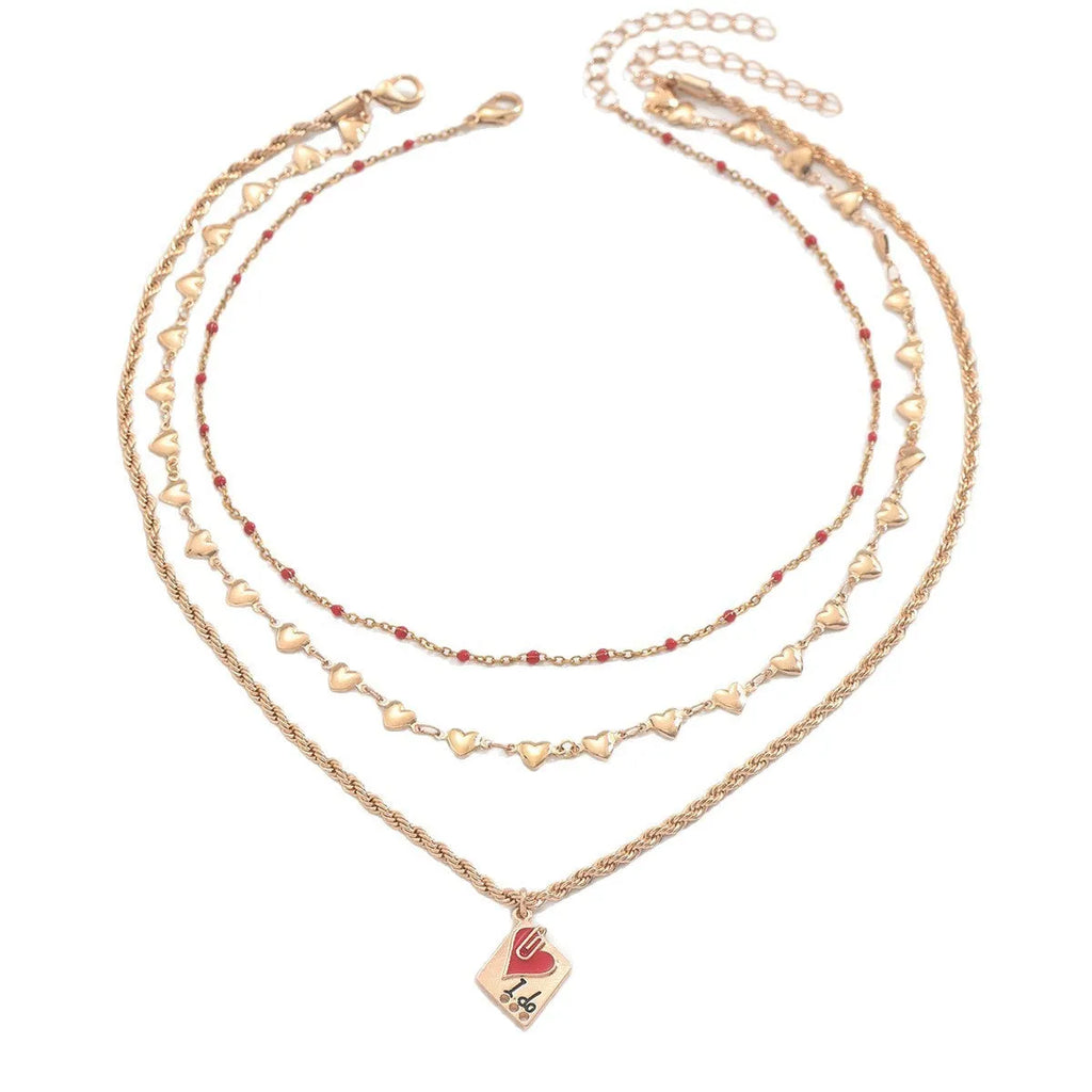 Geometric three-layer heart pendant necklace on a model, showing adjustable clavicle chain length.