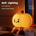 Pumpkin small night lamp in jack-o-lantern style, silicone and plastic construction, rechargeable with USB