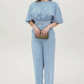 Blue men's casual two-piece suit set with long sleeve shirt and trousers on a hanger