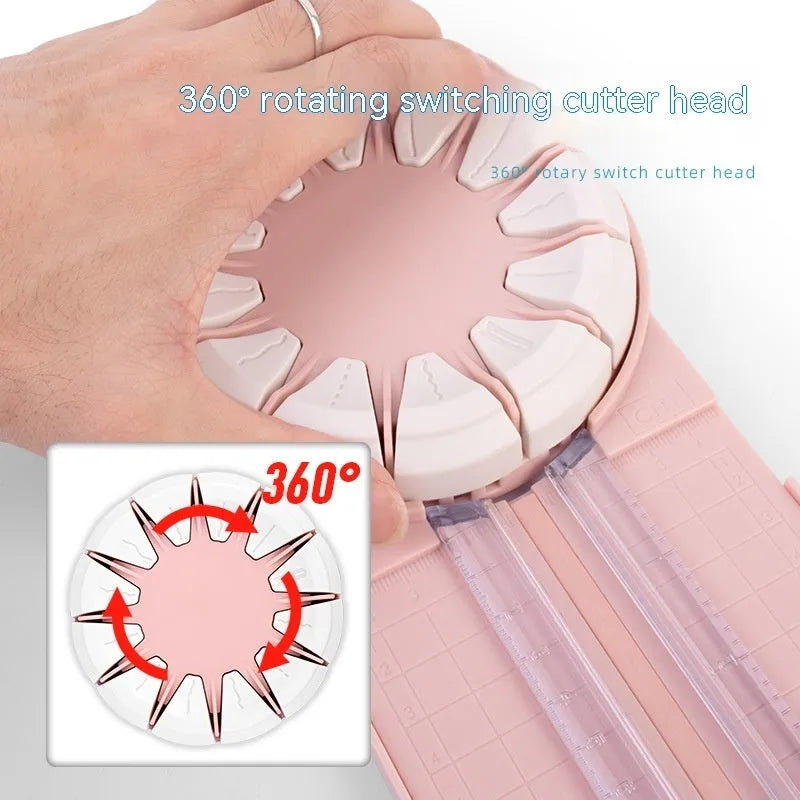 Pink plastic 12-in-1 multifunctional paper cutter with dotted guide lines on a white surface.