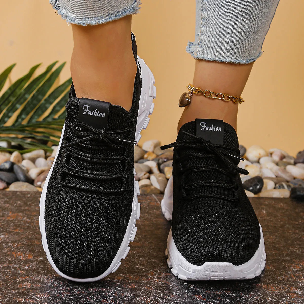 Women's low-top white mesh sports shoes with platform sole and front laces on a grey background.